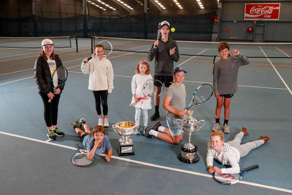 UNIQUE MOMENT: Local tennis players get up close and personal with the Australian Open single trophies. Picture: Morgan Hancock