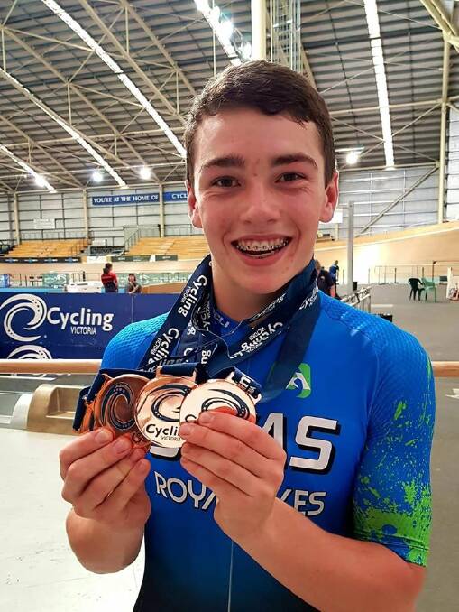 NEW BLING: Eddie Worrall shows off his medals from the Victorian State Track Championships.