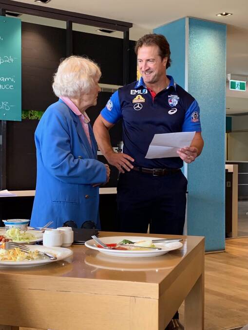 'A GENTLEMEN': Margaret Wilson catches up with Western Bulldogs premiership coach Luke Beveridge at the club's community camp visit on Monday. Picture Western Bulldogs