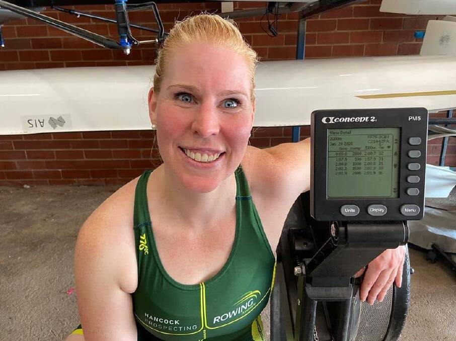 PROOF: Kathryn Ross shows off her split times after breaking a world record rowing 2000 metres on the Concept2 ergo machine. Picture: Rowing ACT