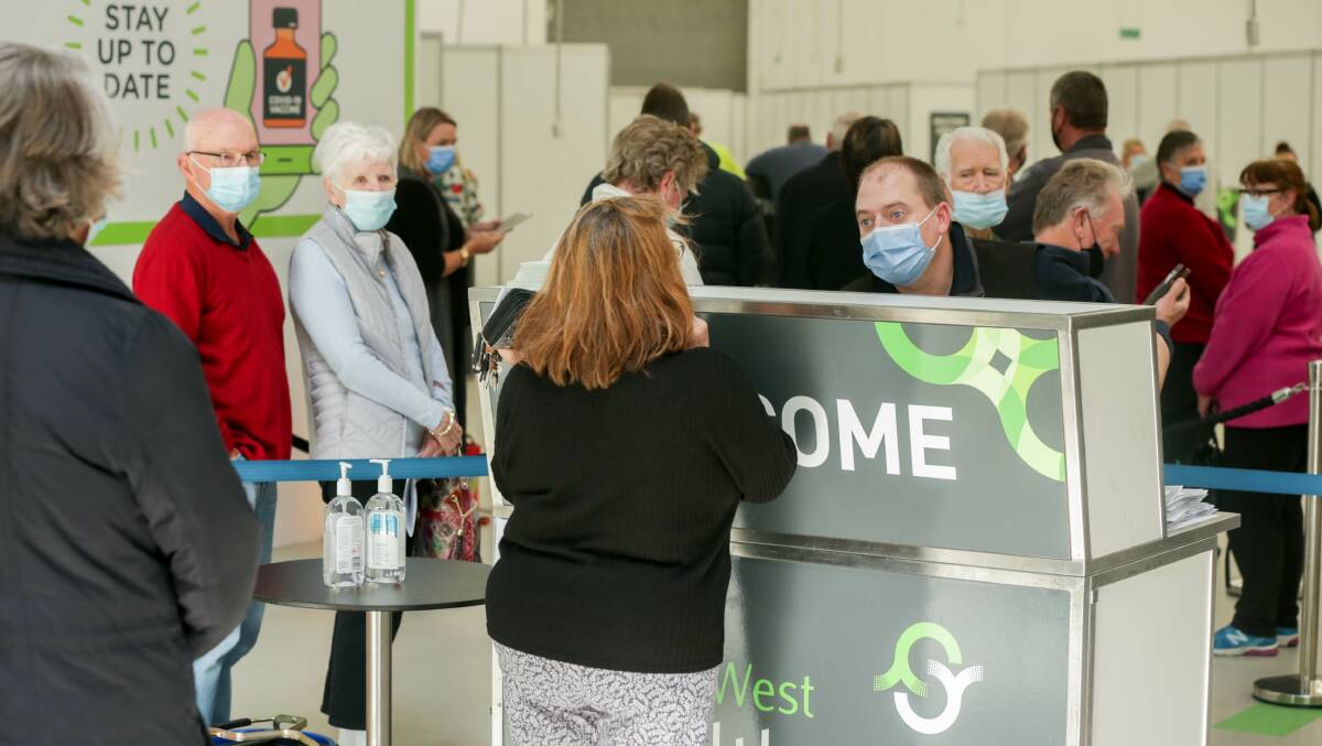 RECORD: Lines have been long at Warrnambool's community vaccination centre on Merri Street with record numbers of victorians getting vaccinated on Friday. Picture: Chris Doheny