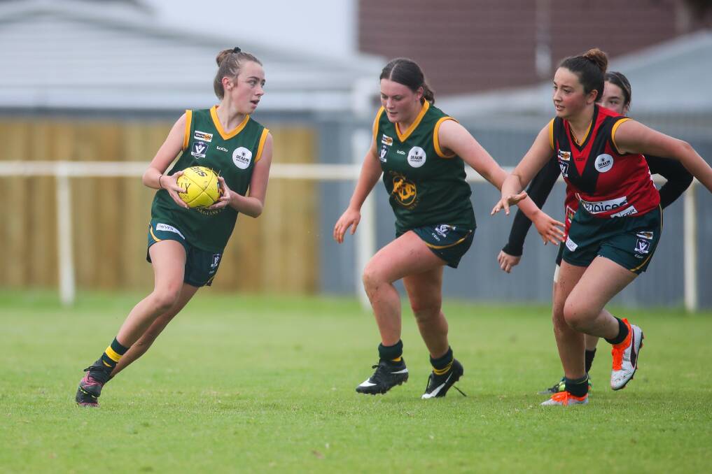 OFF AND RUNNING: Old Collegians' Ava Moore runs with the footy against Stawell. Picture: Morgan Hancock