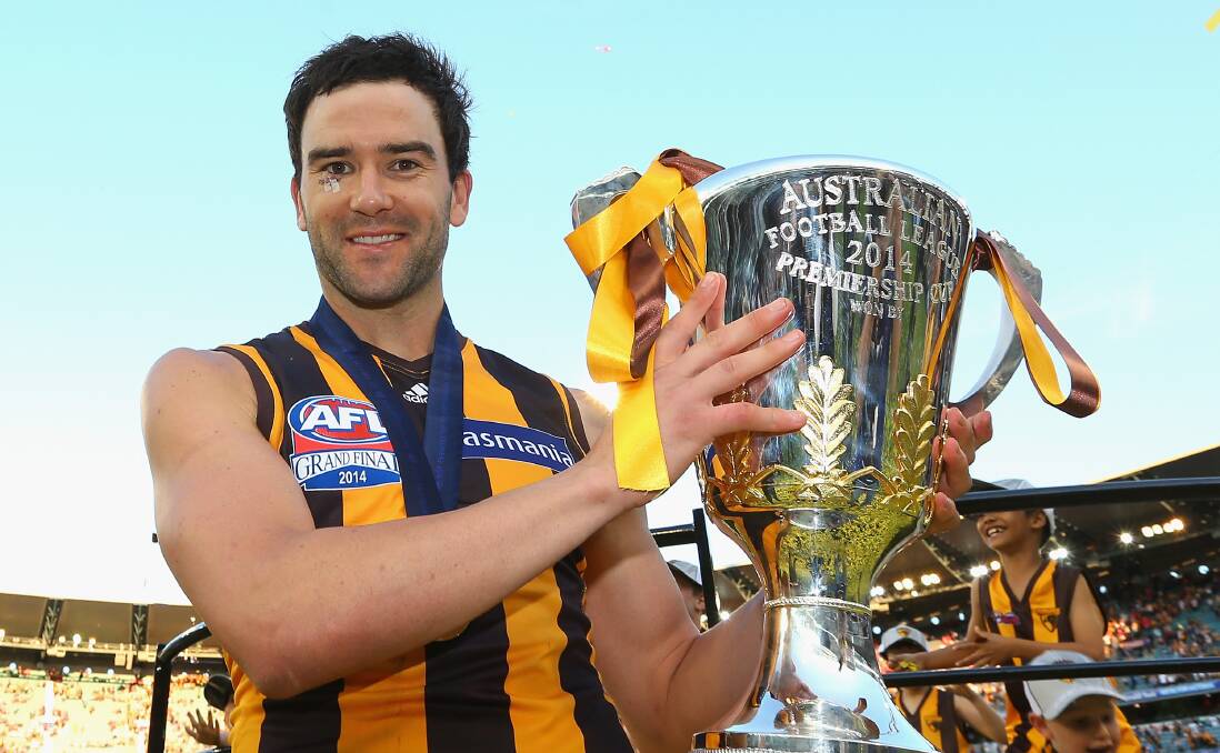 FLAGS: Jordan Lewis with the 2014 premiership cup. This was one of three he won with Hawthorn. Picture: Getty Images