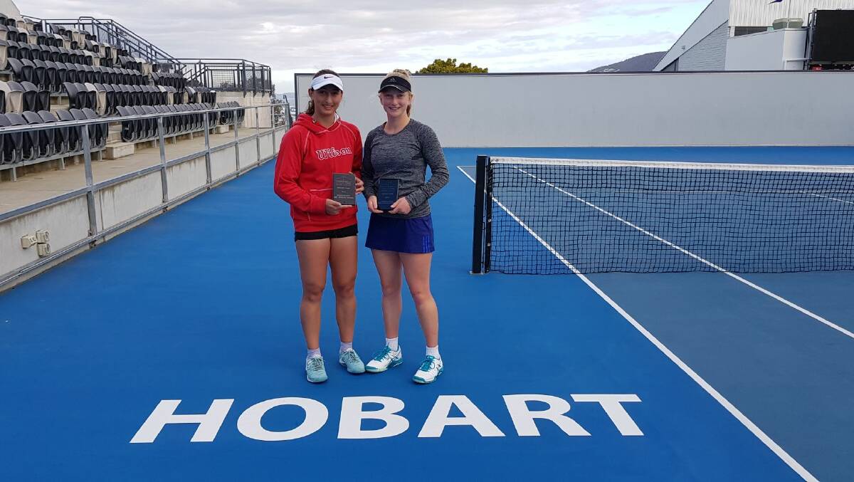 DOUBLE-UP: Eloise Swarbrick poses with Melbourne-based doubles partner Kiana Mokhatari after securing victory in a Hobart silver AMT tournament.