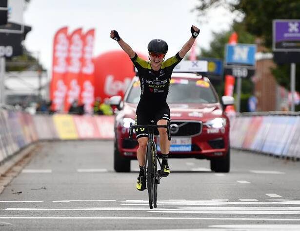 VICTORY: Grace Brown raises her hands as she crosses the finish line for her first professional victory in Europe. Picture: Getty Images