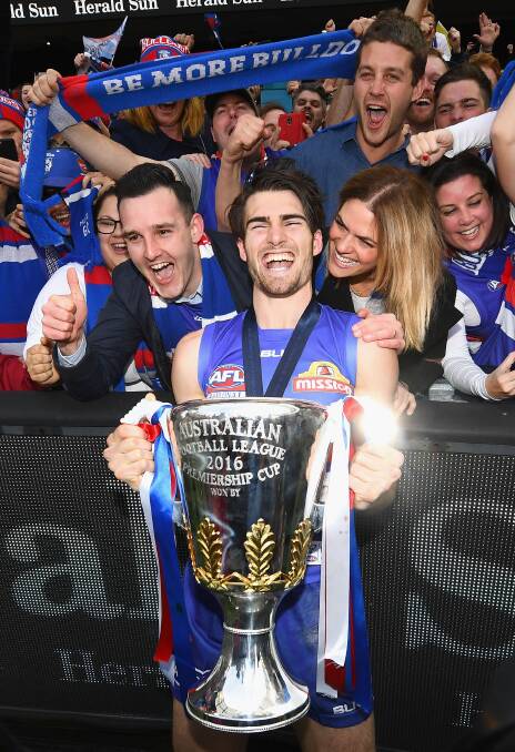 CAPTAIN'S JOY: Easton Wood shares the glory of premiership success with Western Bulldogs fans in 2016. Picture: Getty Images