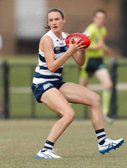 UP FORWARD: Georgia Clarke looks for her next move during Geelong's practice match against the Western Bulldogs. Picture: Michael Willson/AFL Photos via Getty Images