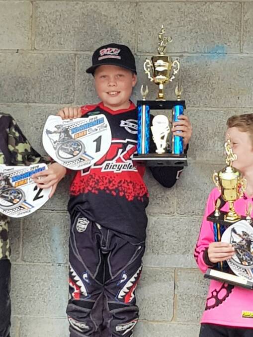 WINNER: Xavier Keilar shows off his trophy and new plate from the Tasmanian Titles. Picture: Supplied