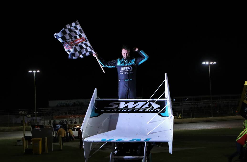 WINNER: Jamie Veal celebrates his Victorian Title win on top of his car. Picture: Sean Hardeman
