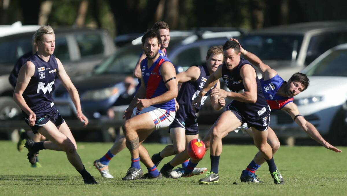 BACK INTO IT: Players chase after a loose ball. Picture: Chris Doheny