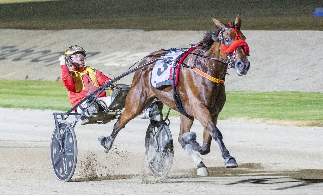 TEAM: Jason Lee and Keayang Livana head towards the victory in the Vicbred Super Series Trotting Mares final last year. Picture: Stuart McCormick