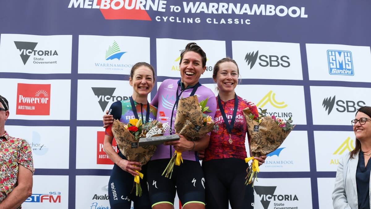 ALL SMILES: The 2021 Melbourne to Warrnambool women's podium of Justine Barrow, Matilda Raynolds and Nicole Frain celebrate with each other. Picture: AusCycling/Con Chronis