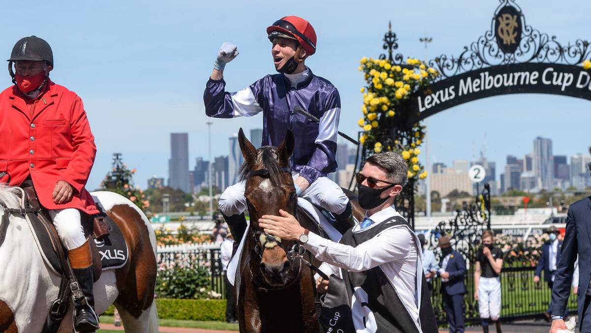 BIG WIN: Jye McNeil guides Twilight Payment back to the mounting yard after winning the Melbourne Cup Picture: Brett Holburt/Racing Photos