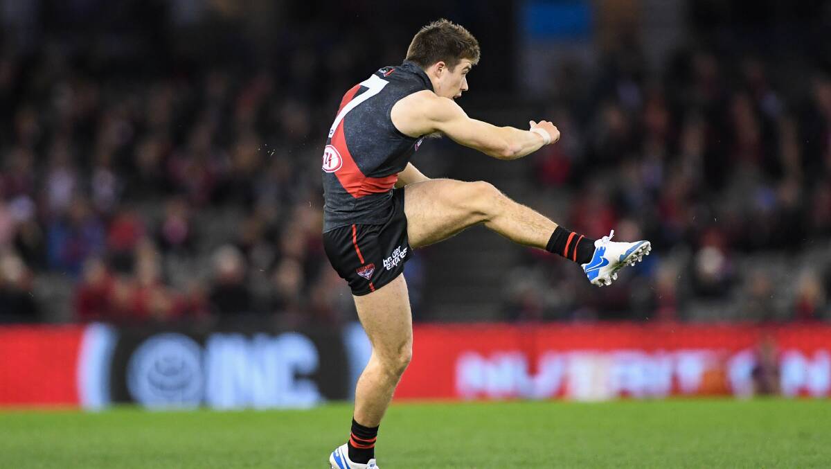GOING LONG: Zach Merrett gets onto his left boot to drive the ball into attack. Picture: Morgan Hancock