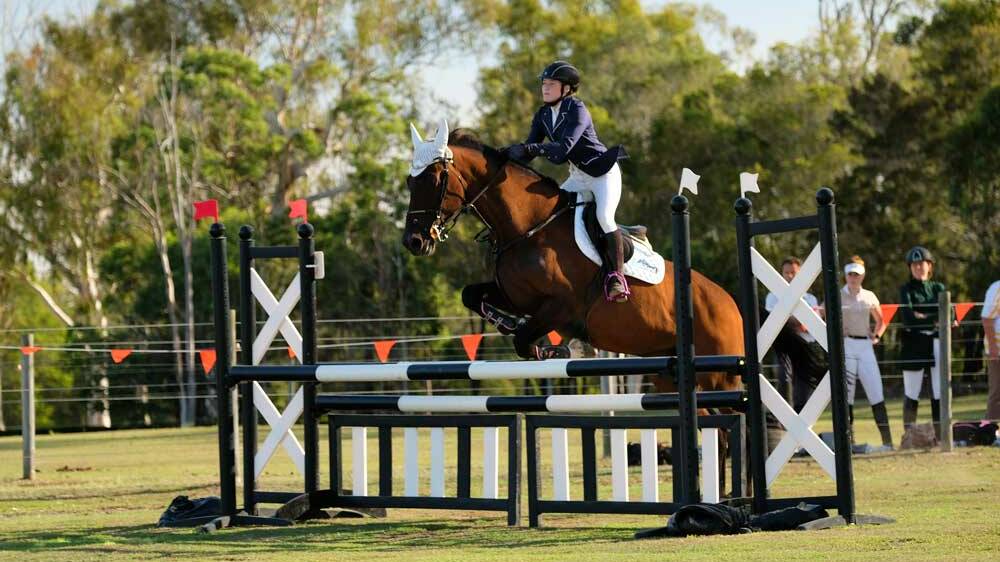 CLEAN RUN: Tully Watt guides her ride through the show jumping stage of the Modern Pentalton. She would finish without a fault in her run. Picture: William Taylor