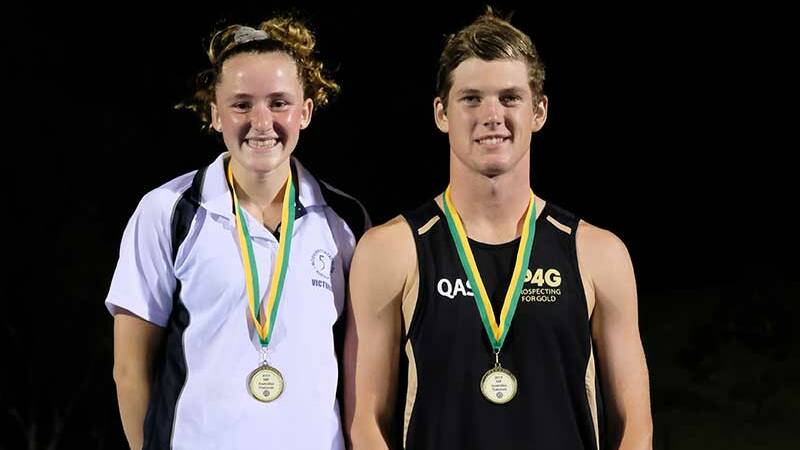 GOLDEN SMILE: Tully Watt poses with open men's winner 17-year-old Queenslander Rhys Lanskey. Picture: William Taylor