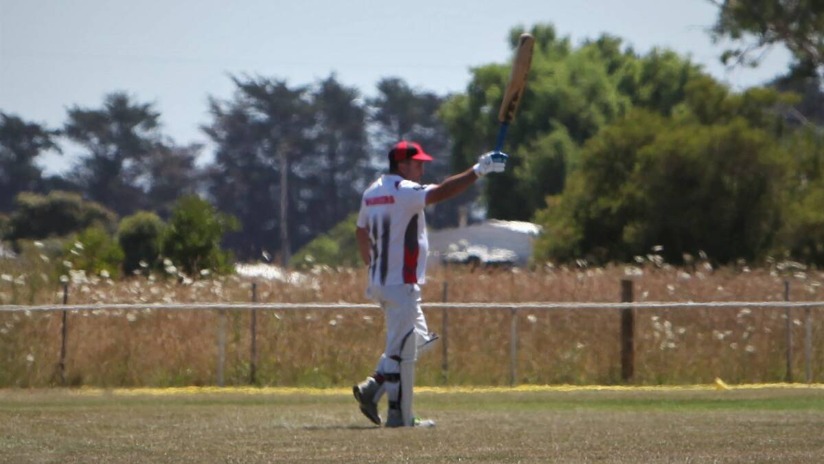DAY OUT: Woolsthorpe's Mick Mahoney raises his bat after scoring a century on Saturday. Picture: Sean Hardeman