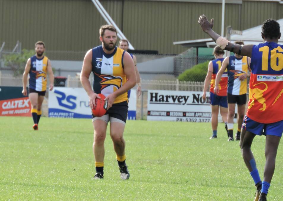LOOKING FORWARD: Hawkesdale-Macarthur's Adrian Bos decides his next move during a game last year. Picture: Anne-Maree Huglin