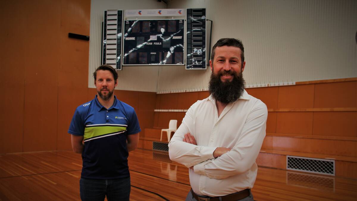 CHANGE OF GUARD: Departing South West Academy of Sport CEO Nic Kaiser (left) with the acadmey's new leader Andrew Sloane (right). Picture: Sean Hardeman