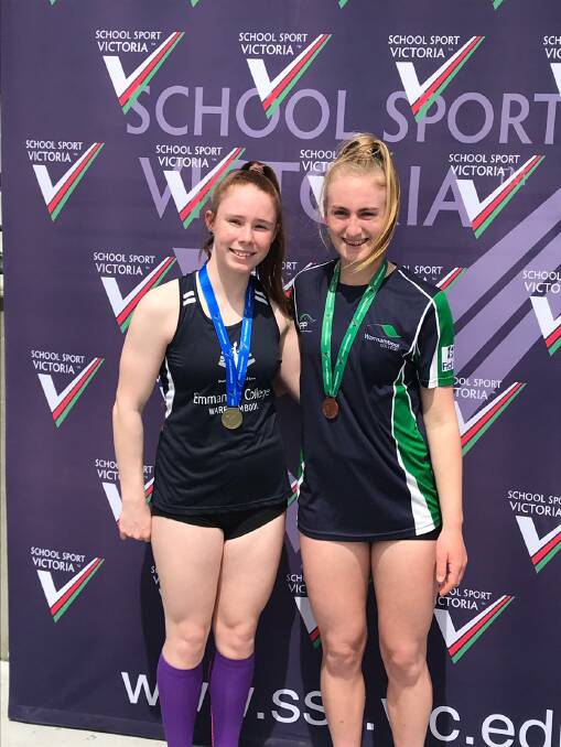 SPRINT STARS: Grace Kelly and Layla Watson pose after winning medals at the championships.
