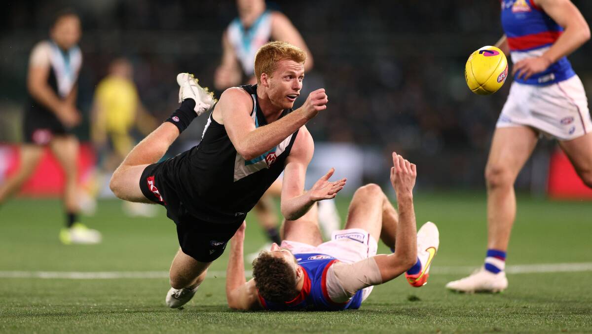 TOUGH NIGHT: Koroit export Willem Drew and the Ken Hinkley-led Port Adelaide were thumped by Easton Wood and the Western Bulldogs. Picture: Getty Images 