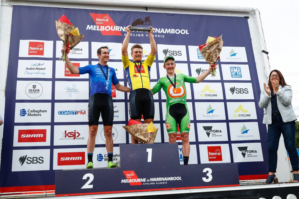 THE PODIUM: Jensen Plowright (middle) stands raises his trophy alongside teammate Ben Hill (second) and Liam White (third). Picture: AusCycling/Con Chronis