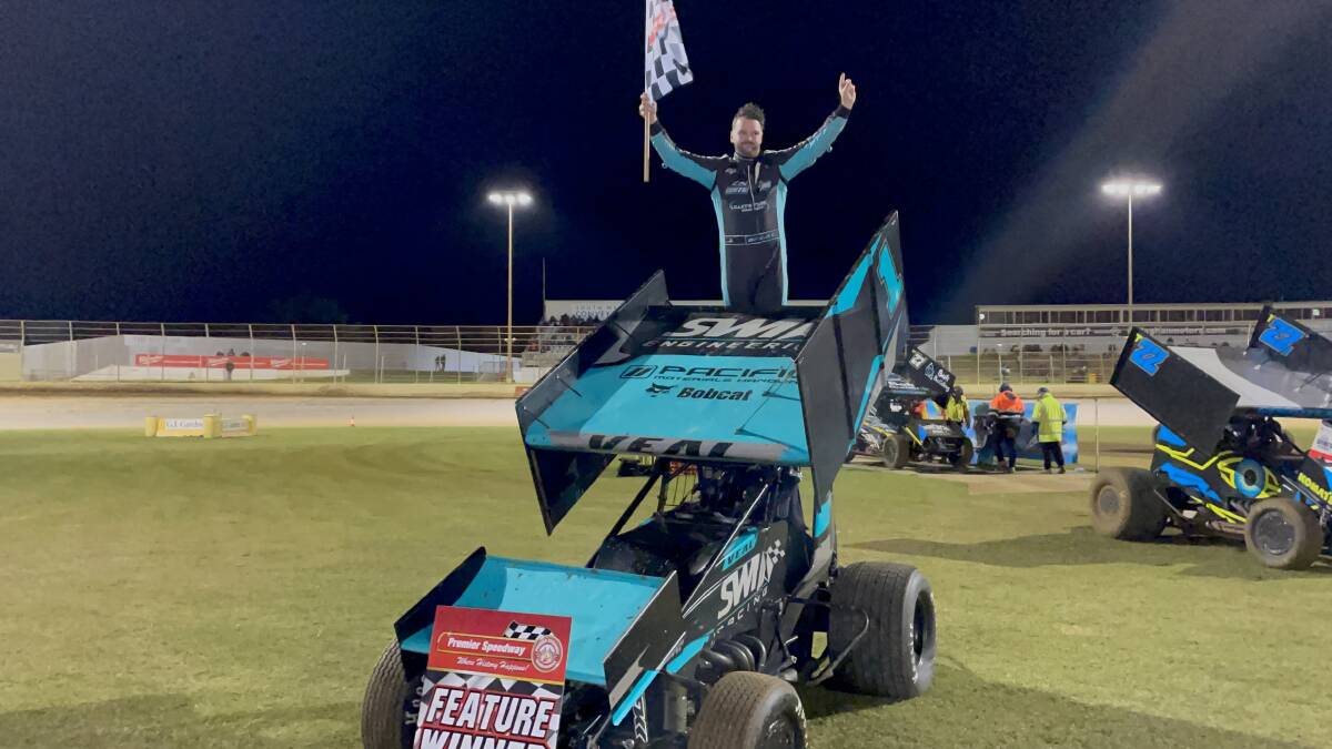 JOB DONE: Jamie Veal celebrates his second Victorian title on top of his car. Picture: Sean Hardeman
