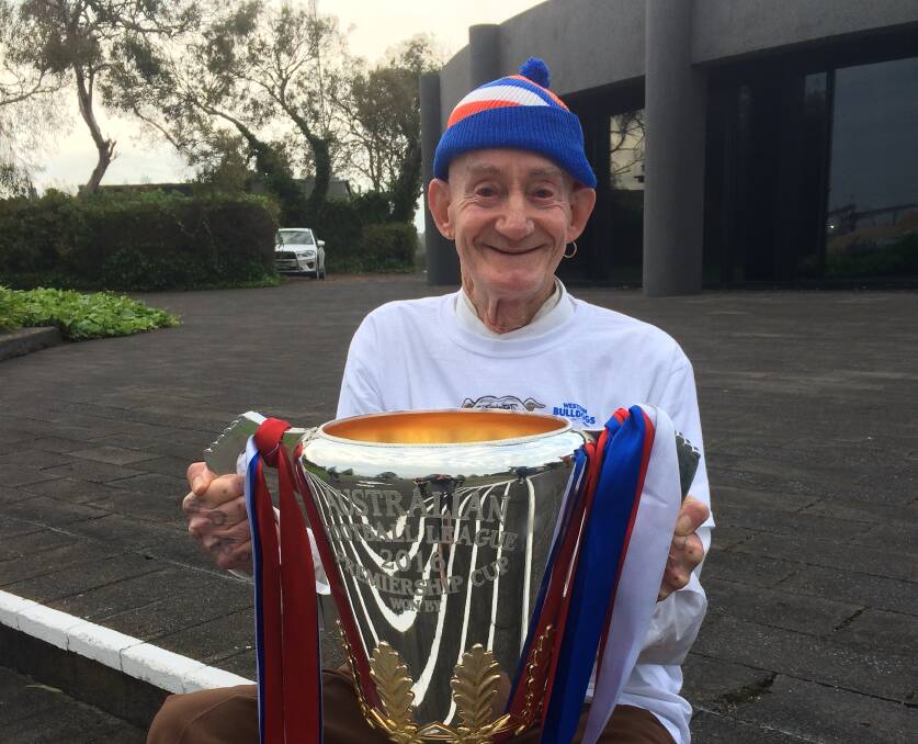 PRIZED MEMORY: Garry Hincks holds the Western Bulldogs 2016 premiership cup.