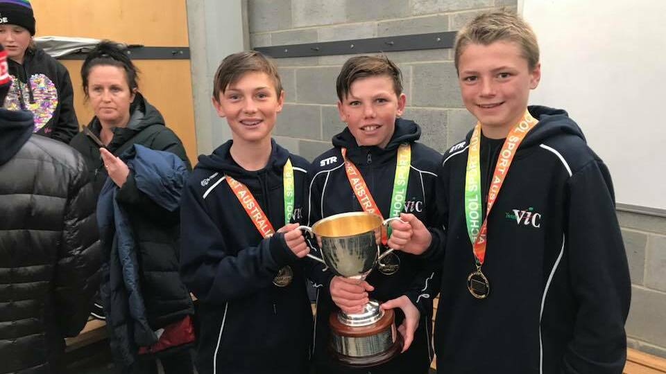 WINNERS: Finn O'Sullivan, middle, after he won gold with Victoria at the School Sport Australia under 12 championships in 2018.