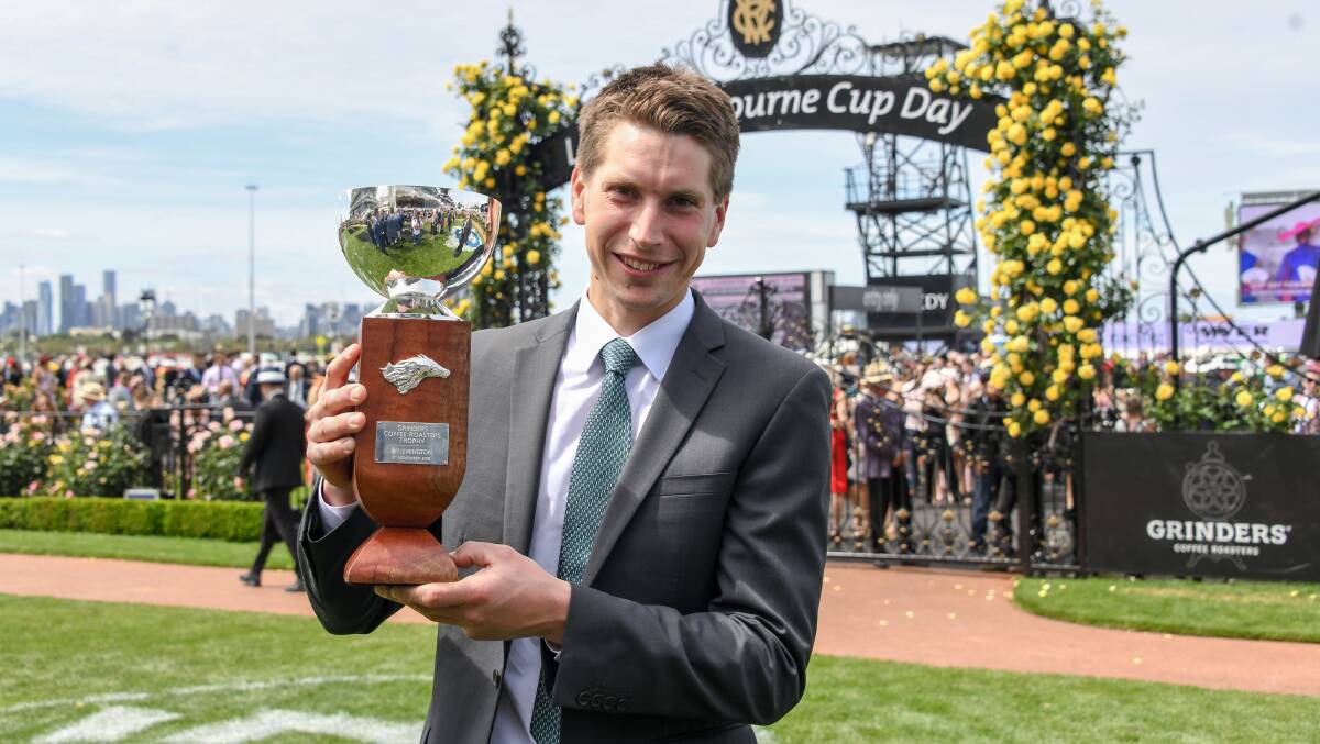 BREAKTHROUGH: Mitchell Freedman with the trophy after Brave Tango won at Flemington on Tuesday. Picture: Alice Laidlaw/Racing Photos