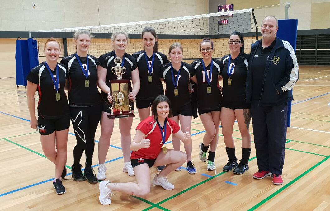 PROUD: Warrnambool Pirates team members Tara Blain, Rachelle Casley, Cheree McKean, Gabby Lougheed, Morgan Edge Izzy Rix, Katelyn Gibson, Eleanor Collins and coach Andrew Van Baaren pose for a photo with the Victorian Country Championships trophy.