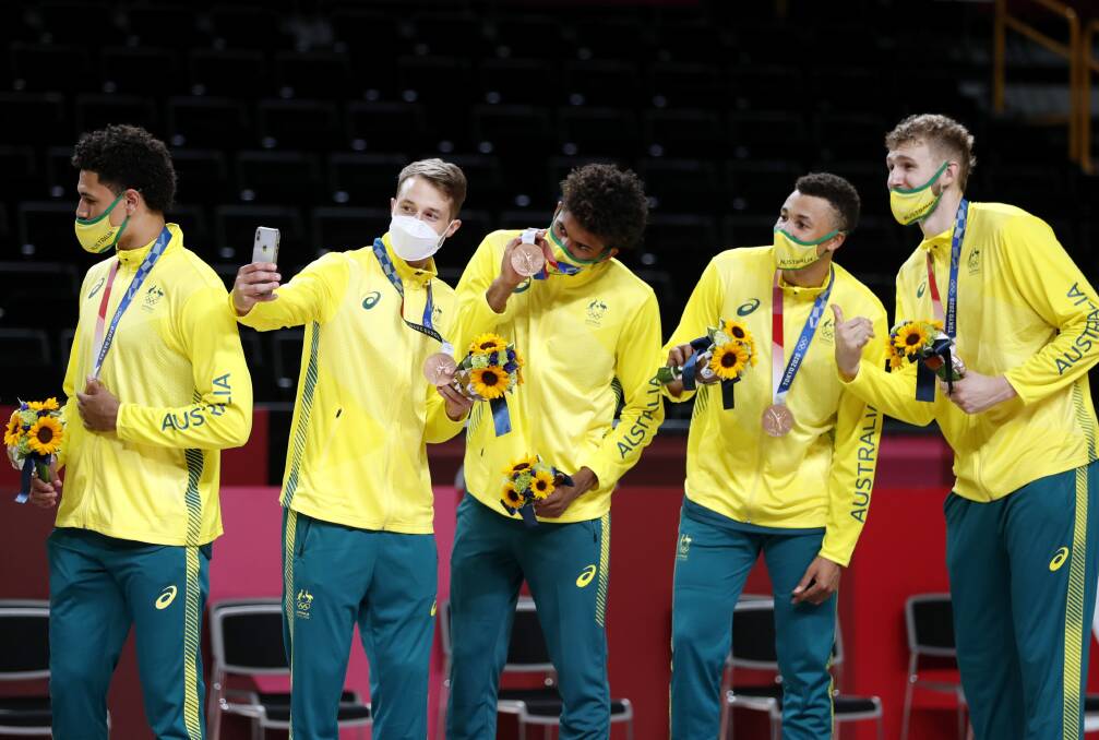 FUN TIMES: Nathan Sobey takes a selfie with Boomers teammates Matisse Thybulle, Dante Exum and Jock Landale. Picture: AAP