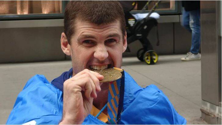 COMPLETED: Jonathan Brown savours his New York Marathon completion medal. Picture: Nova100