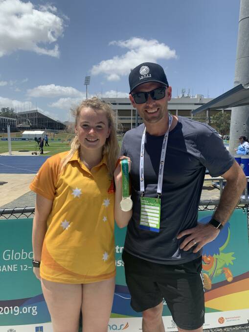 TEAM: Terang's Caytlyn Sharp poses with her coach, Jeremy Dixon, after collecting silver in the high jump.