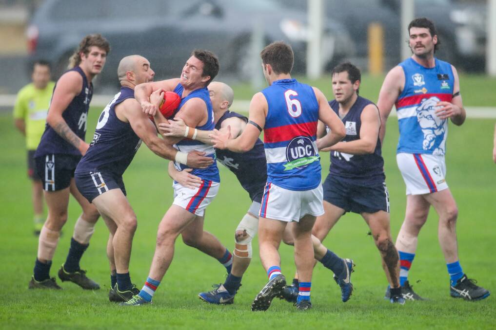 TOUGH DAY: Panmure's Liam Bishop is wrapped up in a tackle. Picture: Morgan Hancock