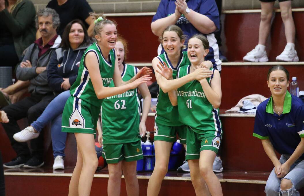 HAPPY TIMES: Warrnambool Mermaids' under 14 team celebrate their country championships victory. Picture: Basketball Victoria