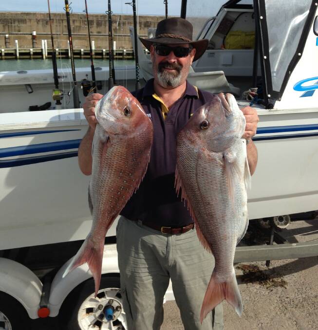 Happy snap: Experienced Warrnambool fisherman Peter Goode, pictured with some snapper he caught, says getting an enclosed harbour developed is a bigger concern than shark sightings.
