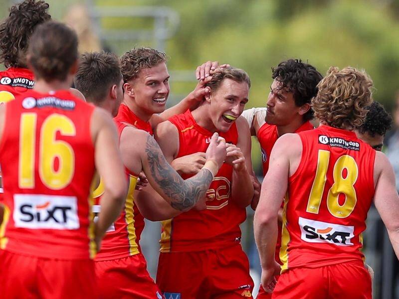 Gold Coast's Sam Clohesy (centre) gets a chance to build on his impressive debut against the Giants. (Matt Turner/AAP PHOTOS)