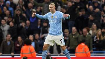 Erling Haaland made up for his earlier 'miss of the season' to score in Man City's 3-1 derby win. (AP PHOTO)