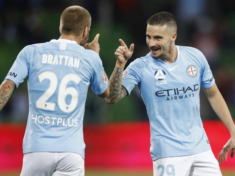 Jamie Maclaren (r) celebrates his first Melbourne City goal in the 1-1 draw with Adelaide United.