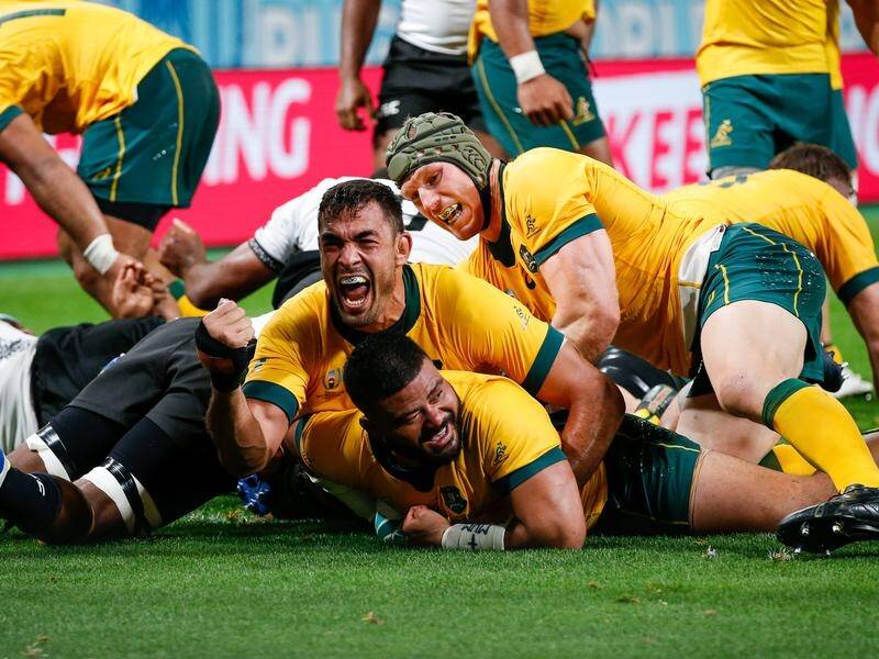 The Wallabies have come back to beat a brave Fiji 39-21 in their Rugby World Cup opener in Japan.