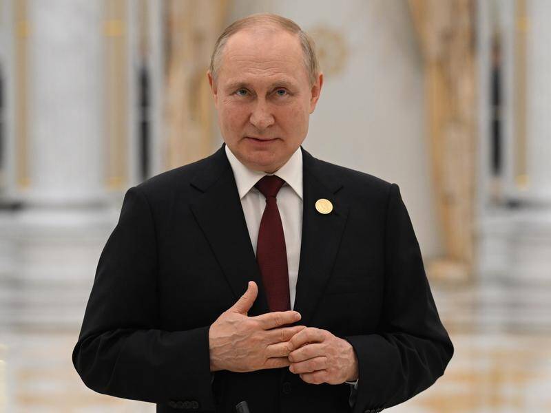 Russian leader Vladimir Putin has visited Crimea on the anniversary of its annexation from Ukraine. (AP PHOTO)