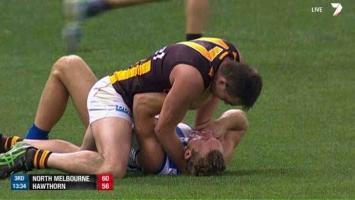 Hawthorn defender Brian Lake chokes his opponent Drew Petrie. Photo: Channel Seven