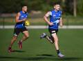 Jack Ziebell (r) says North Melbourne will maintain their AFL focus, despite off-field distractions. (James Ross/AAP PHOTOS)