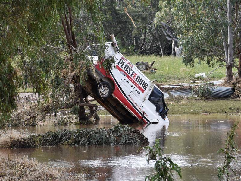 Flood-weary NSW residents are being warned to expect the disaster to continue into the new year. (Murray McCloskey/AAP PHOTOS)