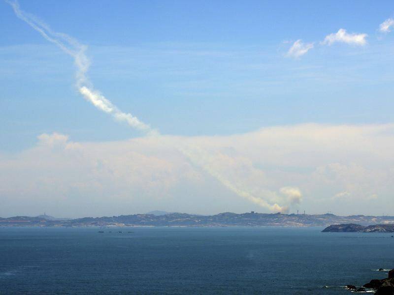 China's military has fired several missiles into waters off Taiwan as part of military exercises. (AP PHOTO)