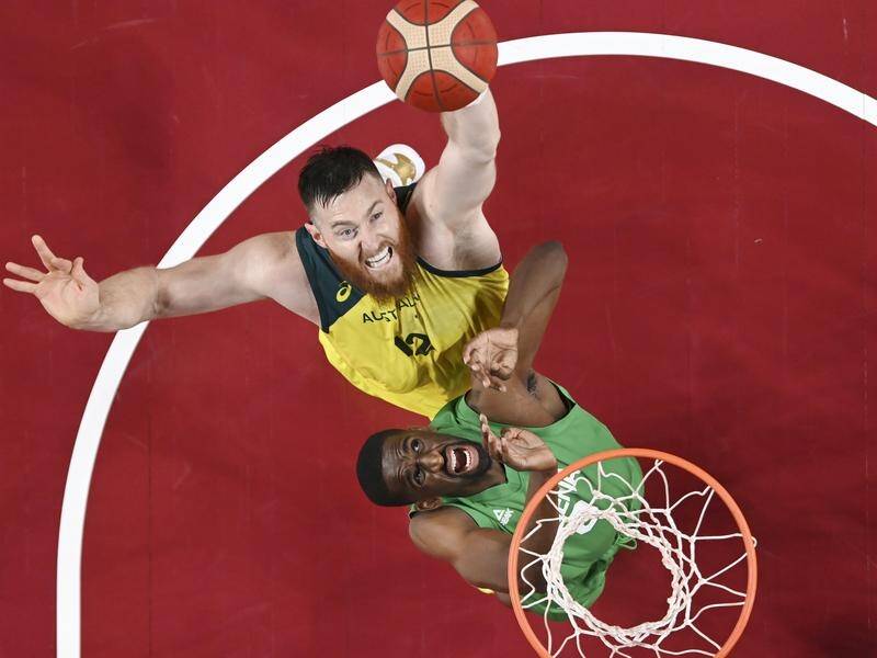 Aron Baynes remained in hospital as his Boomers teammates collected Olympic bronze medals.