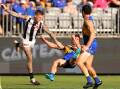 Elijah Hewett goes flying after the bump by Jordan de Goey (l) that has cost the Magpies man a ban. (Richard Wainwright/AAP PHOTOS)