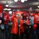 Supporters have begun celebrating as Labor returns for a third term in government. (James Ross/AAP PHOTOS)