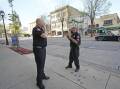 Officers investigate the scene of one of Friday's shootings in downtown Milwaukee.